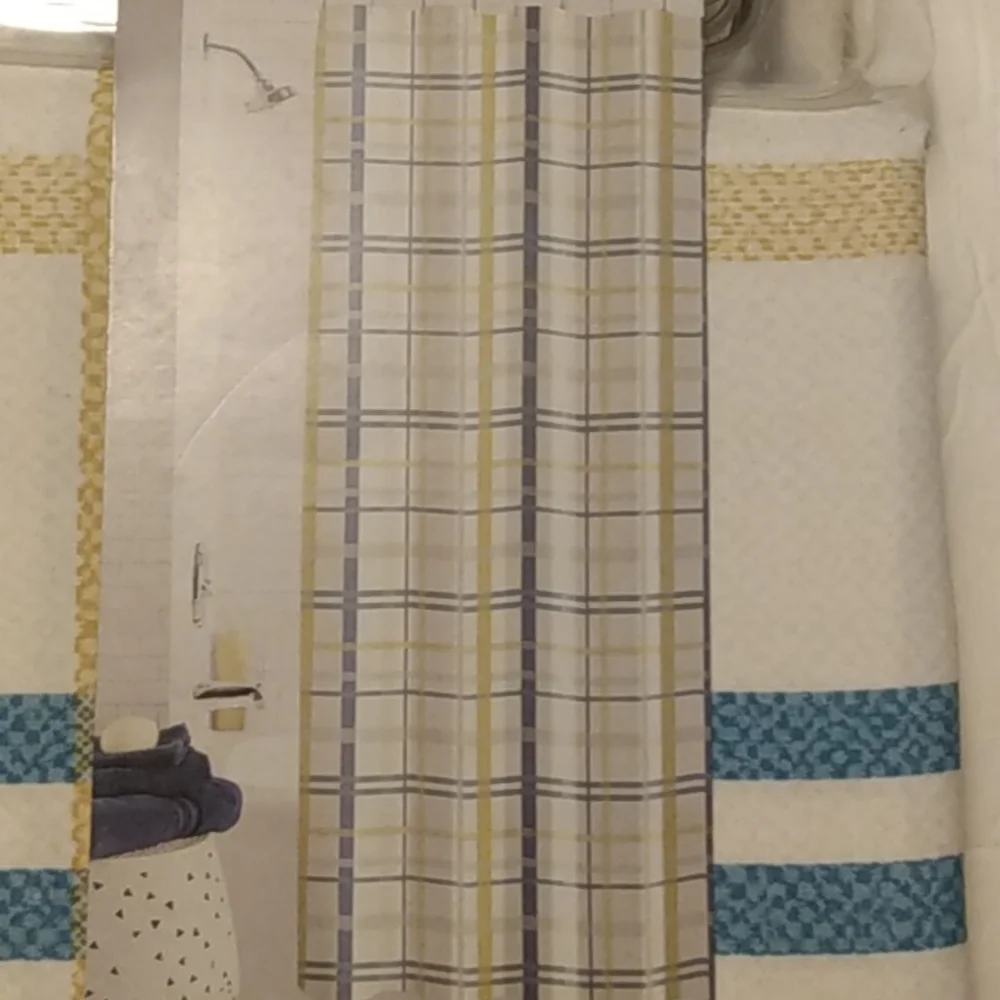 Mainstays 13 piece lightweight multi-colored printed fabric shower curtain.